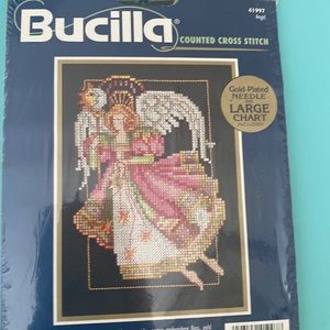 Angel sun cross stitch kit with charm. NEW sealed.